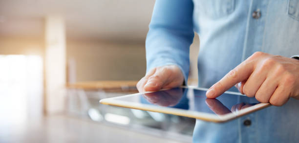 istock Male hand touching a digital tablet 1070127844