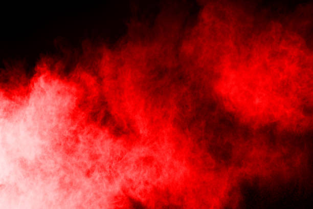 istock abstract red powder explosion on black background.abstract red powder splatted on black background. Freeze motion of red powder exploding. 1070132944