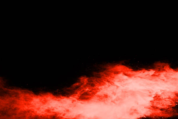 istock abstract red powder explosion on black background.abstract red powder splatted on black background. Freeze motion of red powder exploding. 1070133114