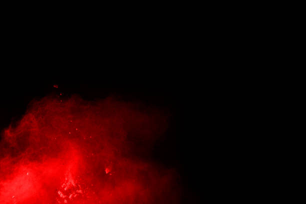 istock abstract red powder explosion on black background.abstract red powder splatted on black background. Freeze motion of red powder exploding. 1070133188
