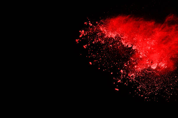 istock abstract red powder explosion on black background.abstract red powder splatted on black background. Freeze motion of red powder exploding. 1070133264
