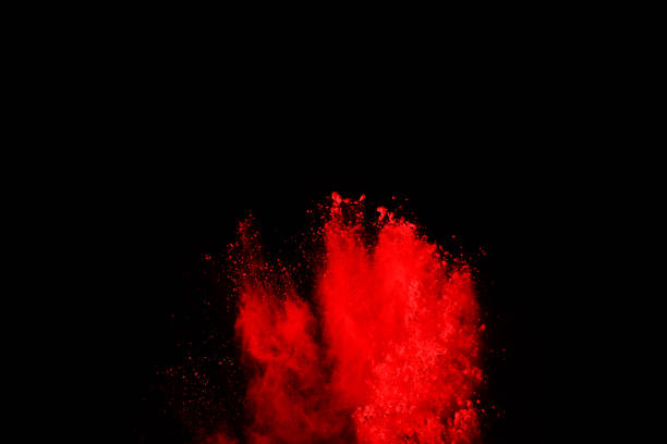 istock abstract red powder explosion on black background.abstract red powder splatted on black background. Freeze motion of red powder exploding. 1070133318