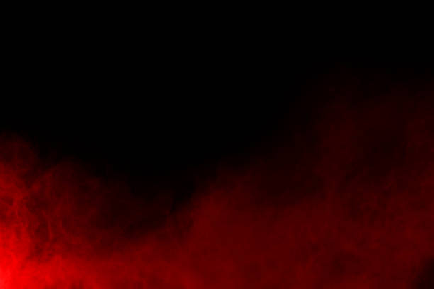 istock abstract red powder explosion on black background.abstract red powder splatted on black background. Freeze motion of red powder exploding. 1070133344