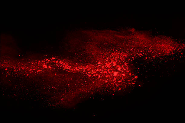 istock abstract red powder explosion on black background.abstract red powder splatted on black background. Freeze motion of red powder exploding. 1070133404