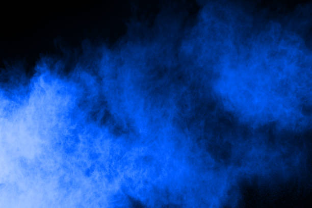 istock abstract blue powder splatted background,Freeze motion of color powder exploding/throwing color powder,color glitter texture on black background. 1070133438