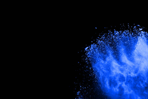 istock abstract blue powder splatted background,Freeze motion of color powder exploding/throwing color powder,color glitter texture on black background. 1070133864