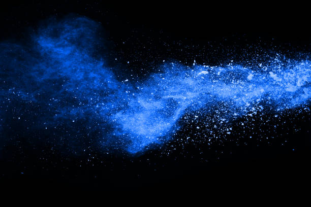 istock abstract blue powder splatted background,Freeze motion of color powder exploding/throwing color powder,color glitter texture on black background. 1070133972