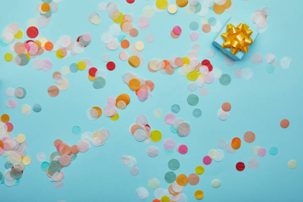 istock Top view of blue gift with golden bow on blue background 1070138270
