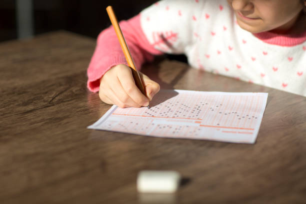 istock Child is marking optical form at the exam 1070138636