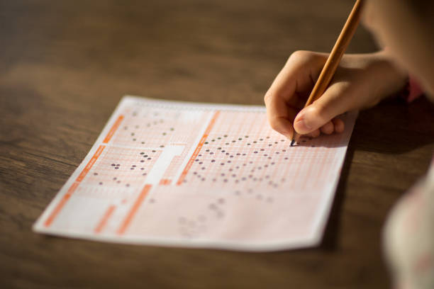 Child is marking optical form at the exam