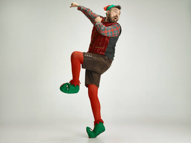 istock friendly man dressed like a funny gnome posing on an isolated gray background 1070142056