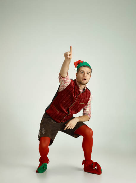 istock friendly man dressed like a funny gnome posing on an isolated gray background 1070142082