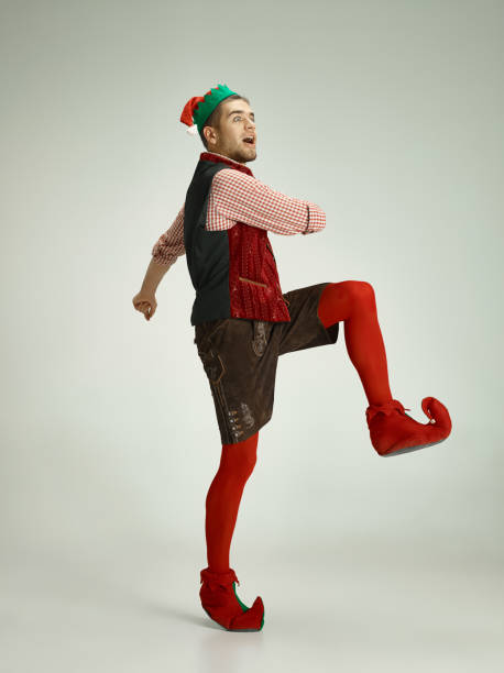istock friendly man dressed like a funny gnome posing on an isolated gray background 1070142104
