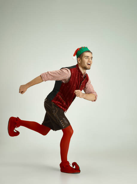 istock friendly man dressed like a funny gnome posing on gray background 1070142120