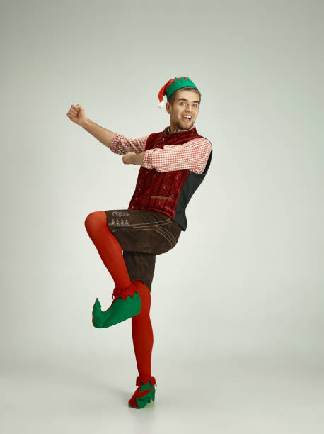 istock friendly man dressed like a funny gnome posing on gray background 1070142206
