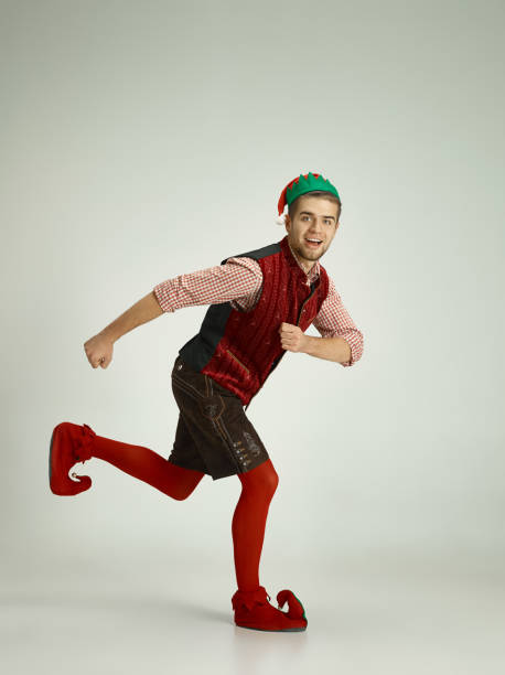 istock friendly man dressed like a funny gnome posing on gray background 1070142364