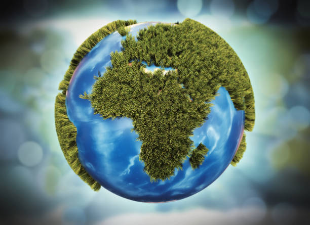 istock Stylized Earth globe with cartoony grass isolated on bokeh background 1070147770