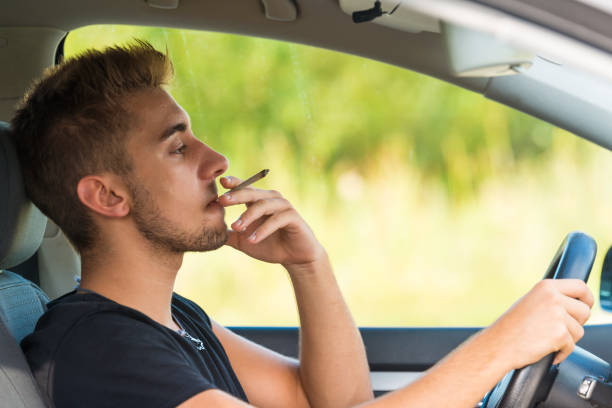 Man with marijuana in car Man with marijuana in car cannabis narcotic stock pictures, royalty-free photos & images