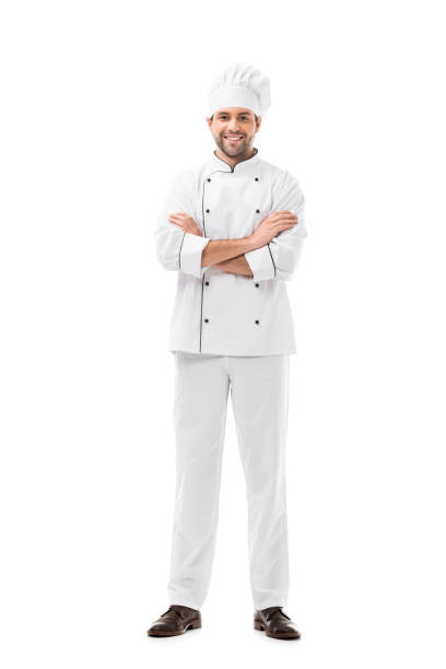istock happy young chef with crossed arms looking at camera isolated on white 1070151512