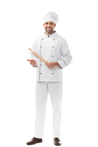 istock handsome young chef holding rolling pin and looking at camera isolated on white 1070153938