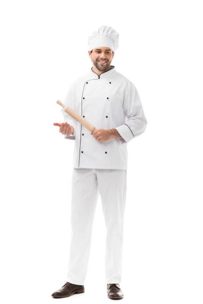 istock handsome young chef holding rolling pin isolated on white 1070153958