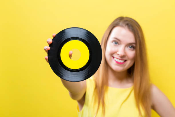 istock Young woman with a vinyl record 1070154160