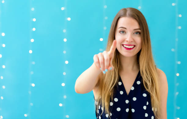 istock Young woman pointing at something 1070154374