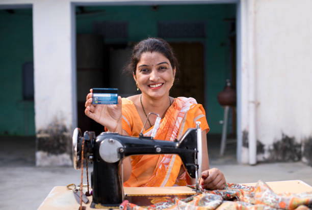 istock Seamstress holding credit card 1070154526