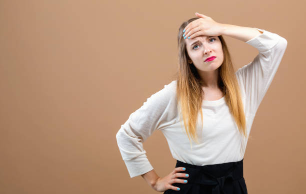 istock Young woman suffering from headache 1070154548