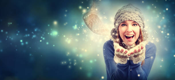 istock Happy young woman blowing snow 1070155786
