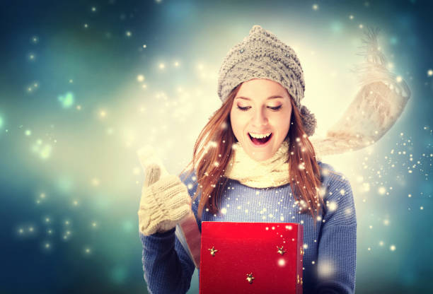 istock Happy young woman with Christmas present box 1070156192