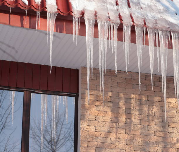 istock icicles on building roof at winter day 1070156276