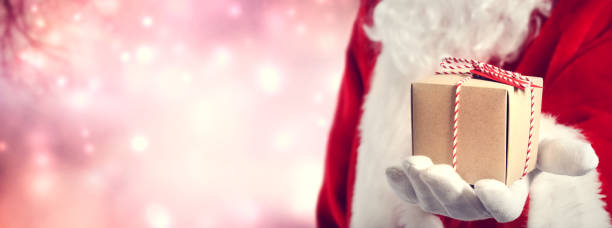 istock Santa Claus holding gift 1070156558