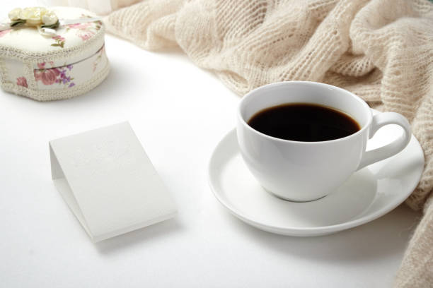 istock A Cup of fragrant black coffee and a textured wool blanket. Warm tone 1070156700