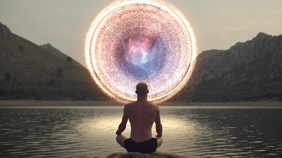Spiritual Awareness. Man opening portal to other galaxy.