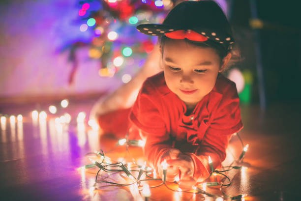 istock little girl withs christmas lights 1070159140