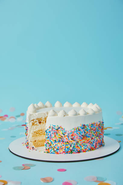 istock Delicious cake cut into pieces on blue background 1070159312