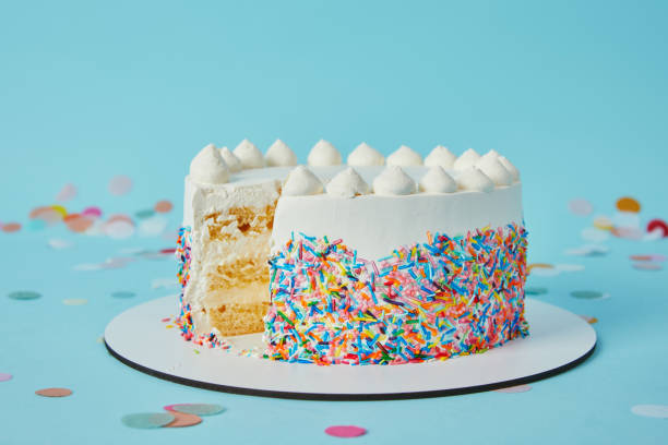 istock Delicious cut cake cut on blue background 1070159330