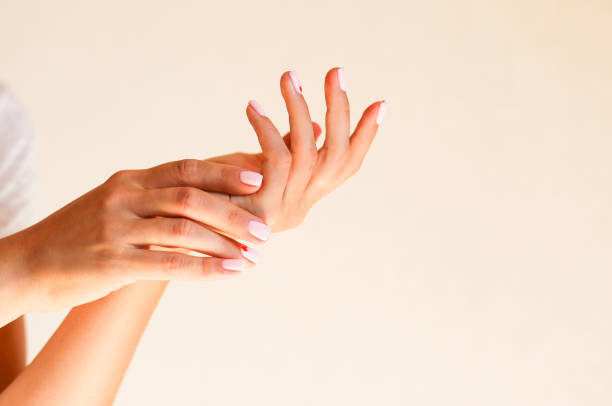 istock Manicure hands on the light background with space for text 1070160100