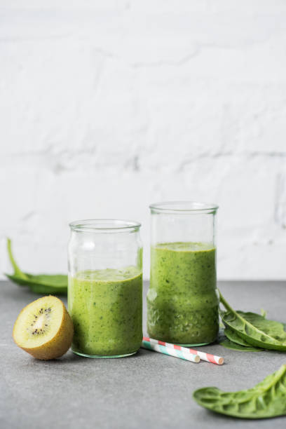 istock Nutritious and healthy organic green smoothie in glasses 1070160402
