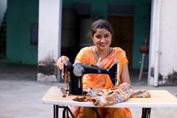 istock Woman sewing clothes with sewing machine 1070162638