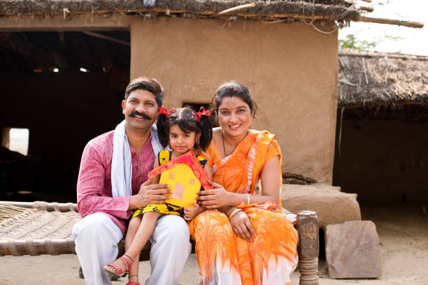 istock Indian family holding dream house model 1070162770