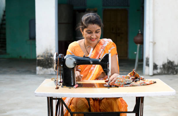 istock Woman sewing clothes with sewing machine 1070162880