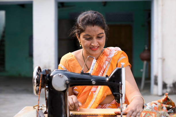 istock Woman sewing clothes with sewing machine 1070163096