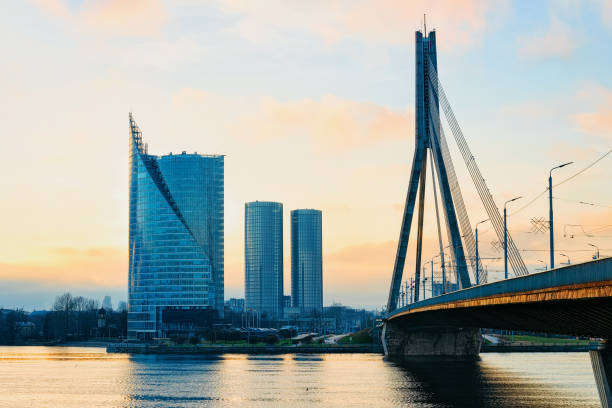 modern business skyscrapers vansu bridge above daugava river riga - daugava river imagens e fotografias de stock