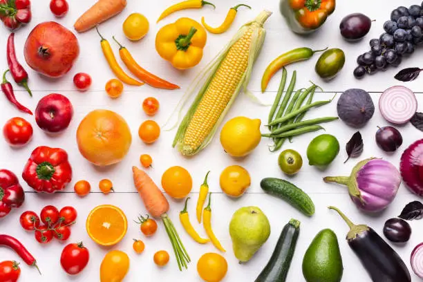 Photo of Composition of fruits and vegetables in rainbow colors