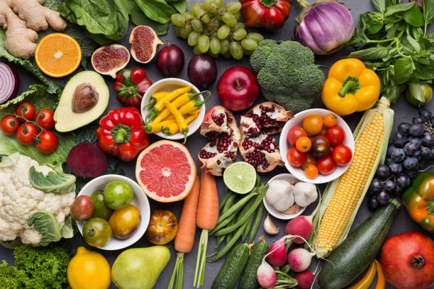 istock Assorted fresh ripe fruits and vegetables background 1070166124