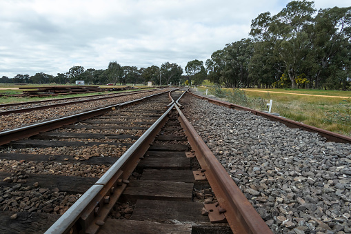 Low angle view of railway track leading into the distance