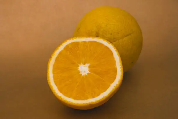 orange with half of orange isolated on the gold background
