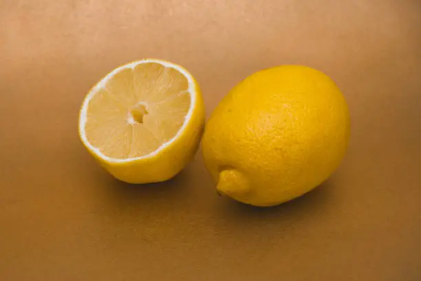 fresh lemon fruits isolated on gold background